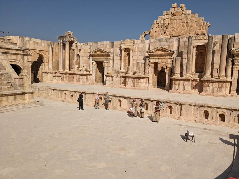 Ancient ruins with people in traditional clothing