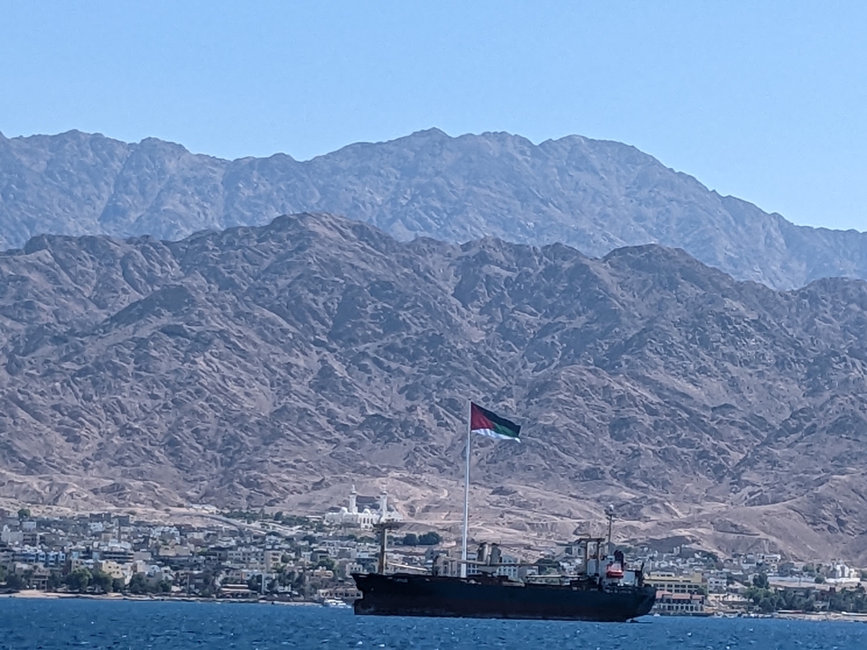 Mountain range with a flagpole
