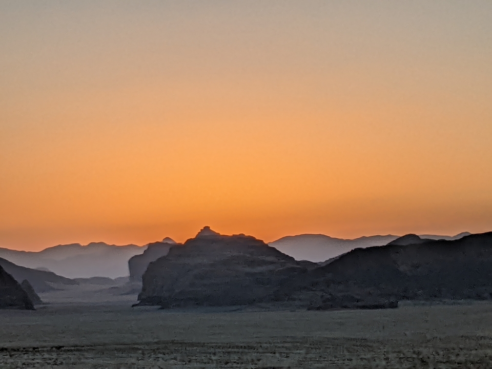 Sunset over desert mountains