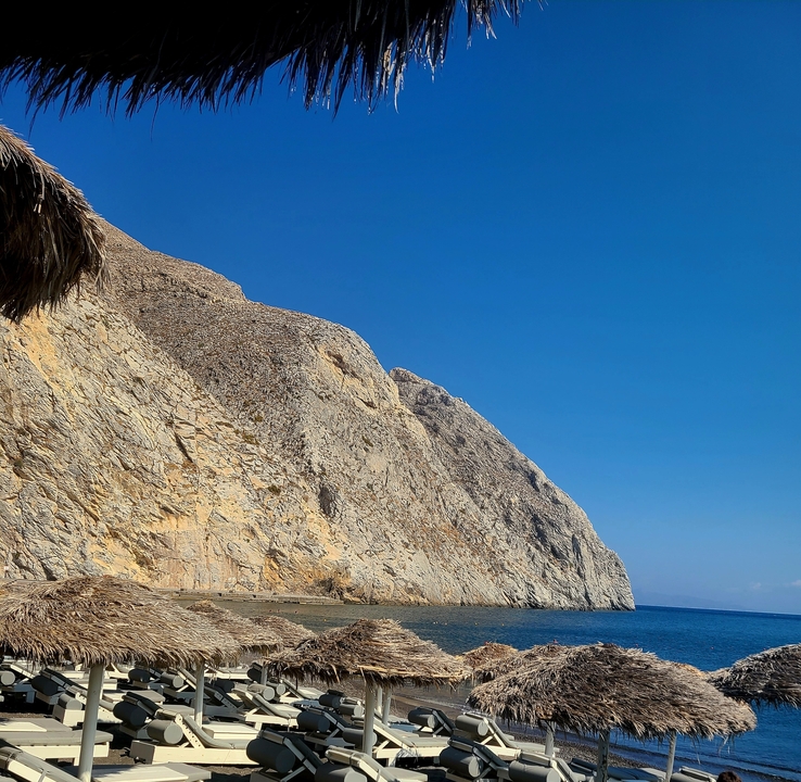 Mountainous landscape with a clear blue sky.