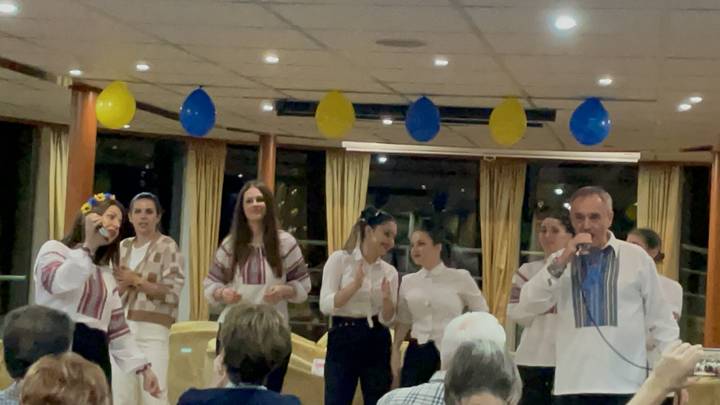 Group of performers singing and clapping