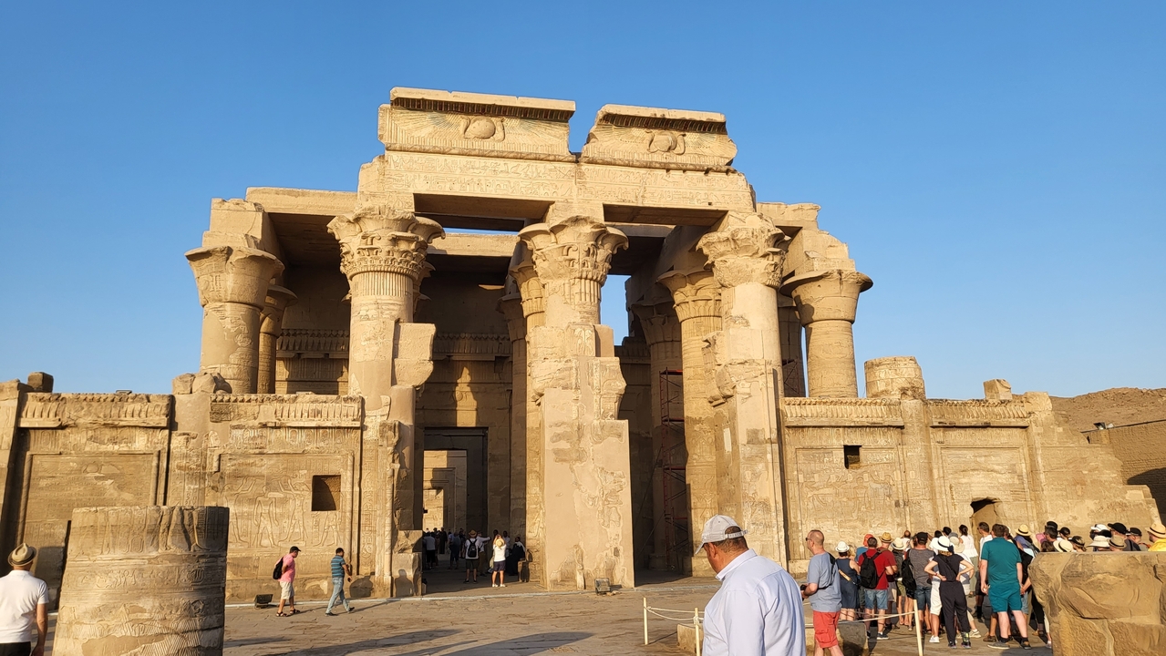 Temple entrance with visitors around.