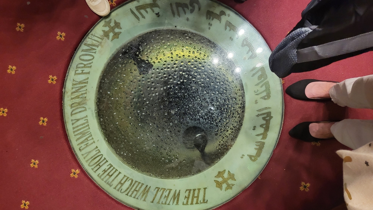 View of a well with text surrounding it.