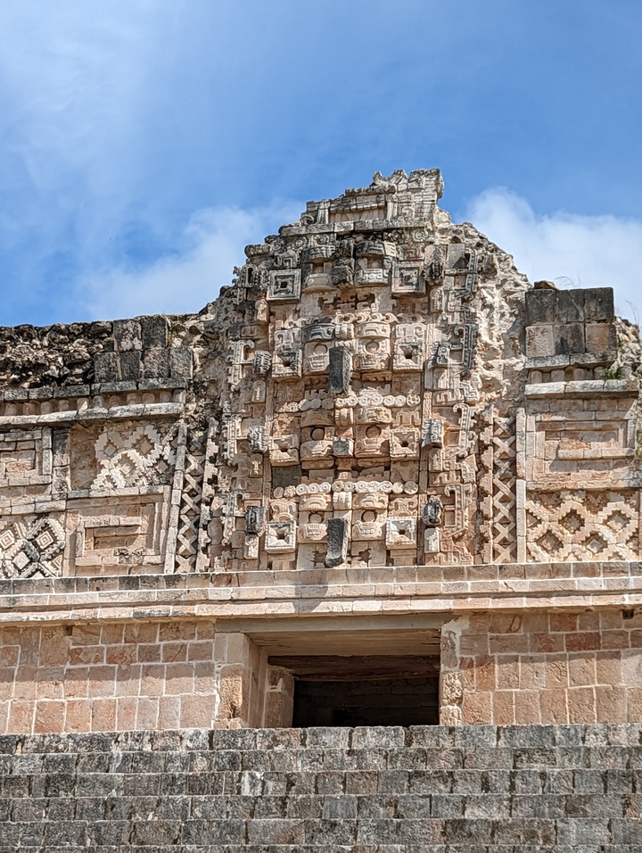 Close-up of Mayan carvings on a temple wall.
