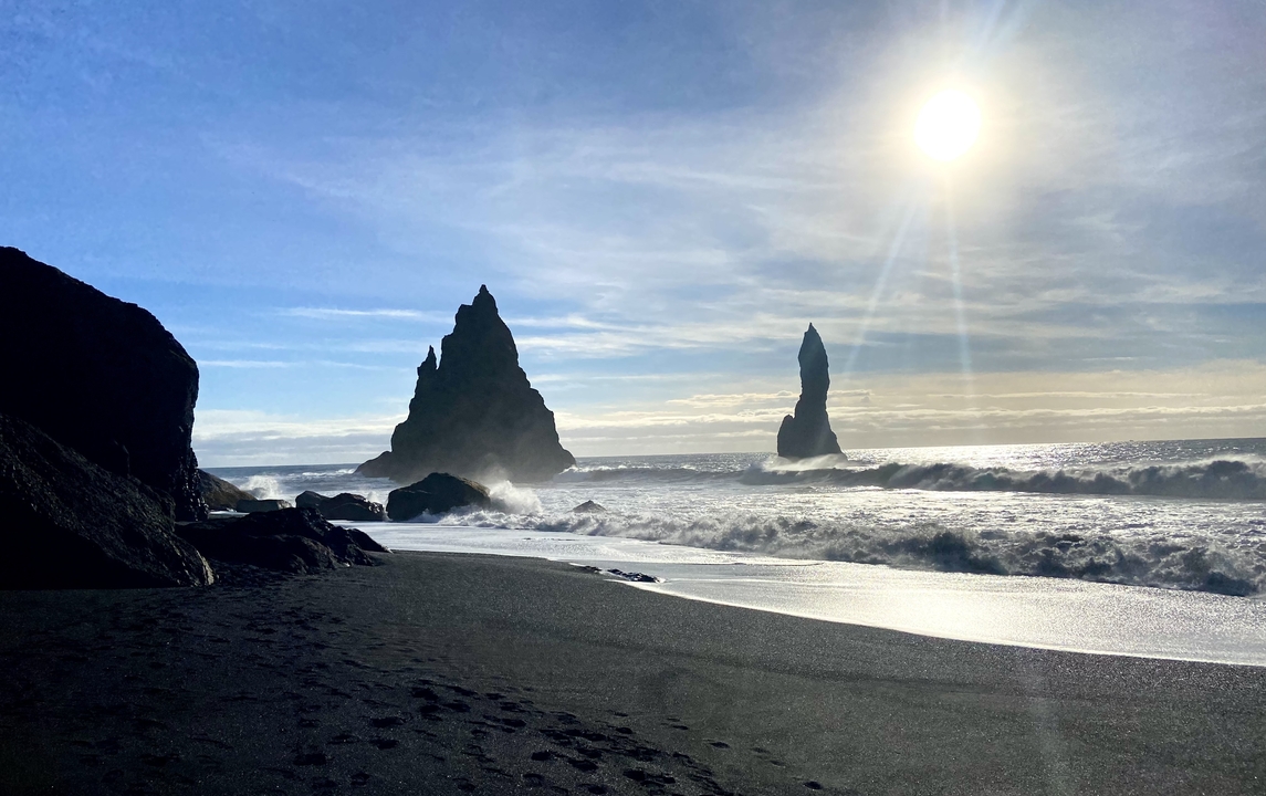Dramatic basalt sea stacks in a rugged coastal setting.