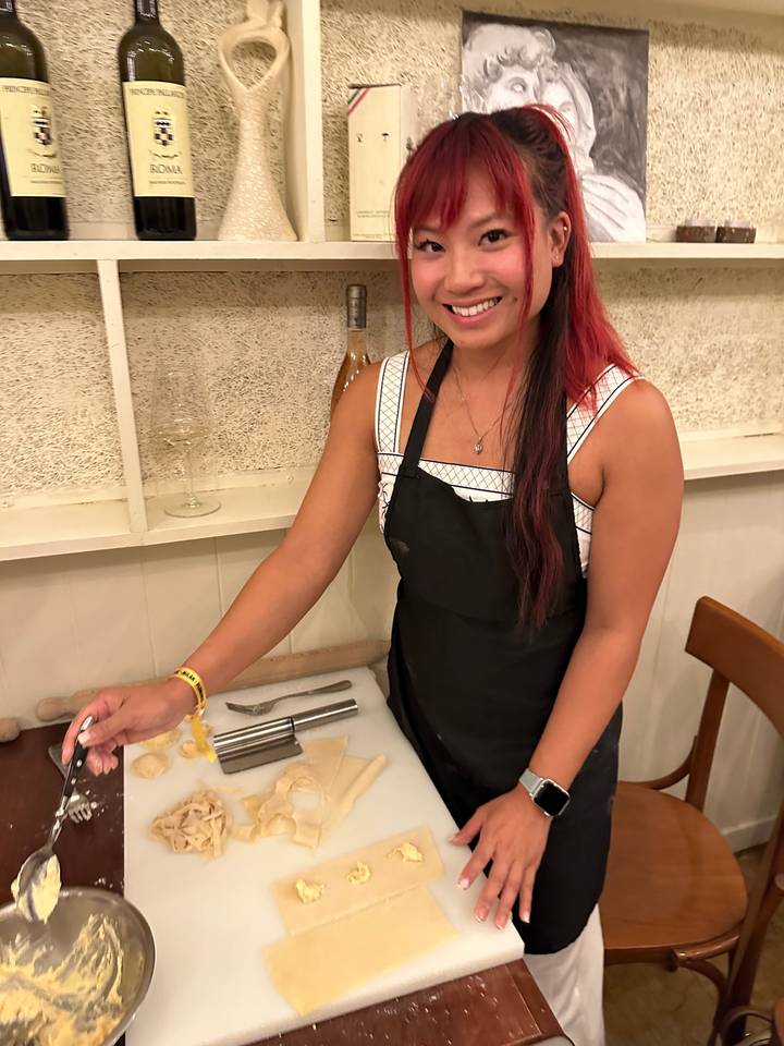 Person posing with cooking ingredients.