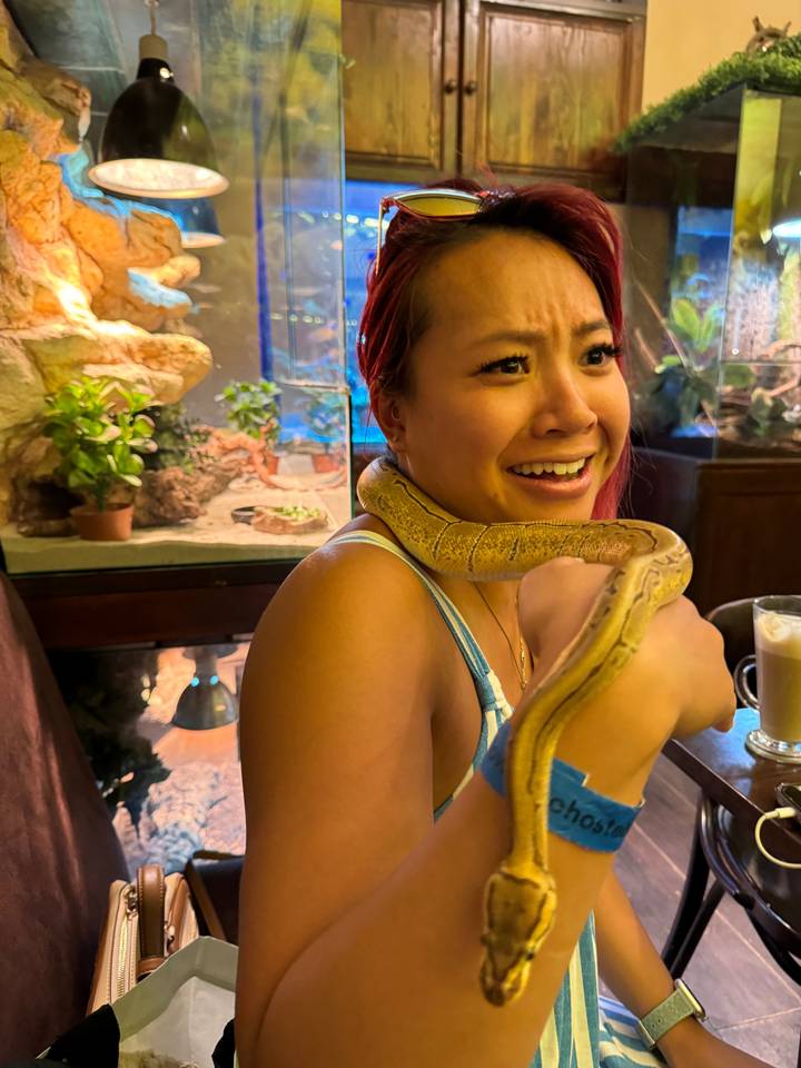 Person holding a snake.