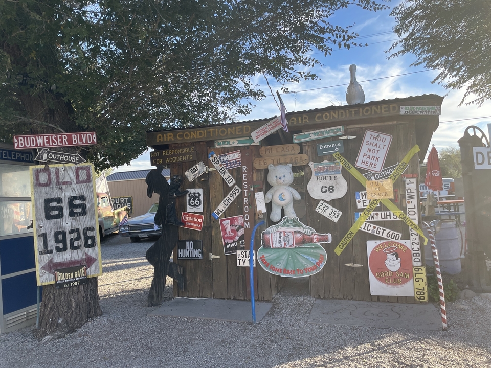 A rustic shop with Route 66 signs and decor.