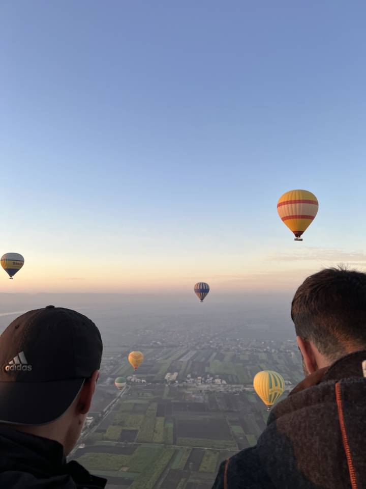 Hot air balloons in the sky at sunrise.