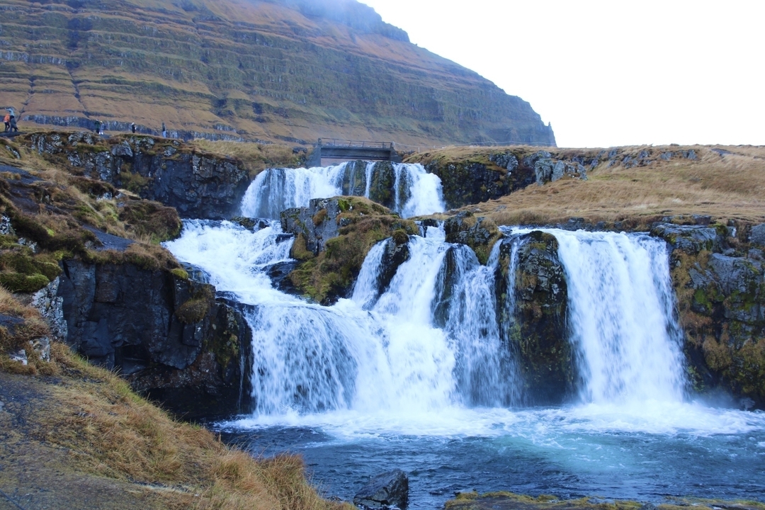 A picturesque waterfall cascading down rocky ledges.