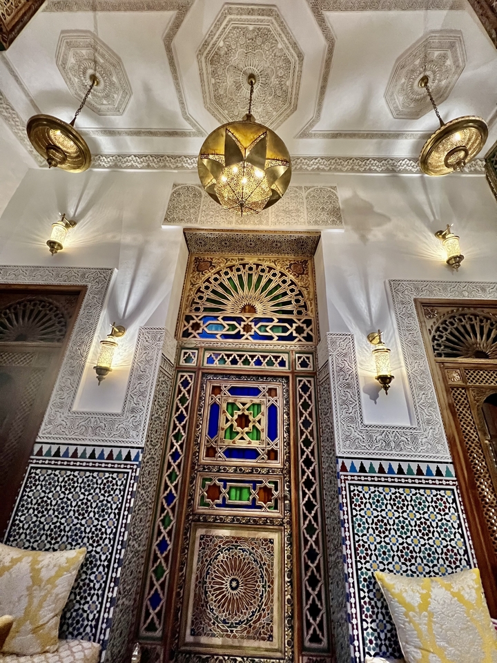 Intricate interior architecture with colorful windows.