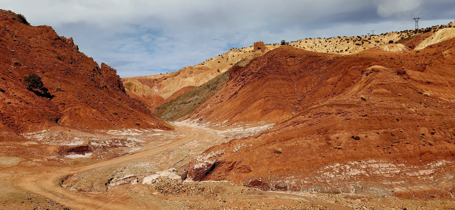Colorful layered rock formations in a desert landscape.