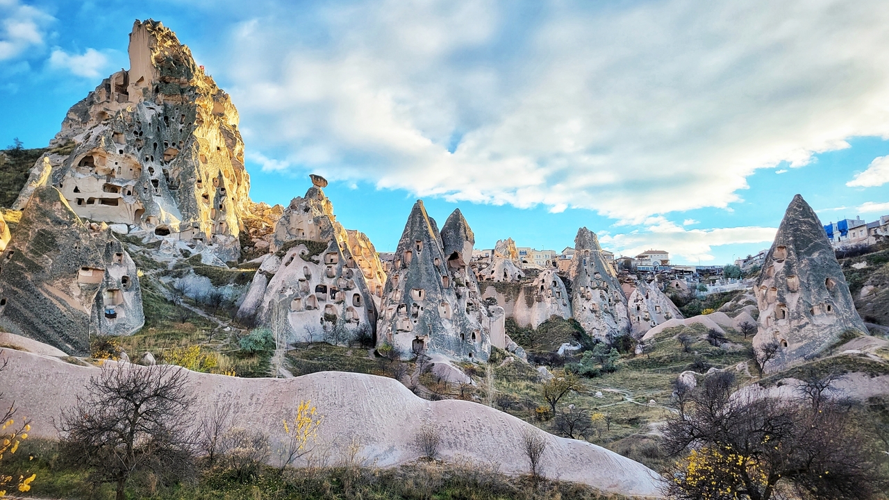 Unique rock formations under a blue sky.