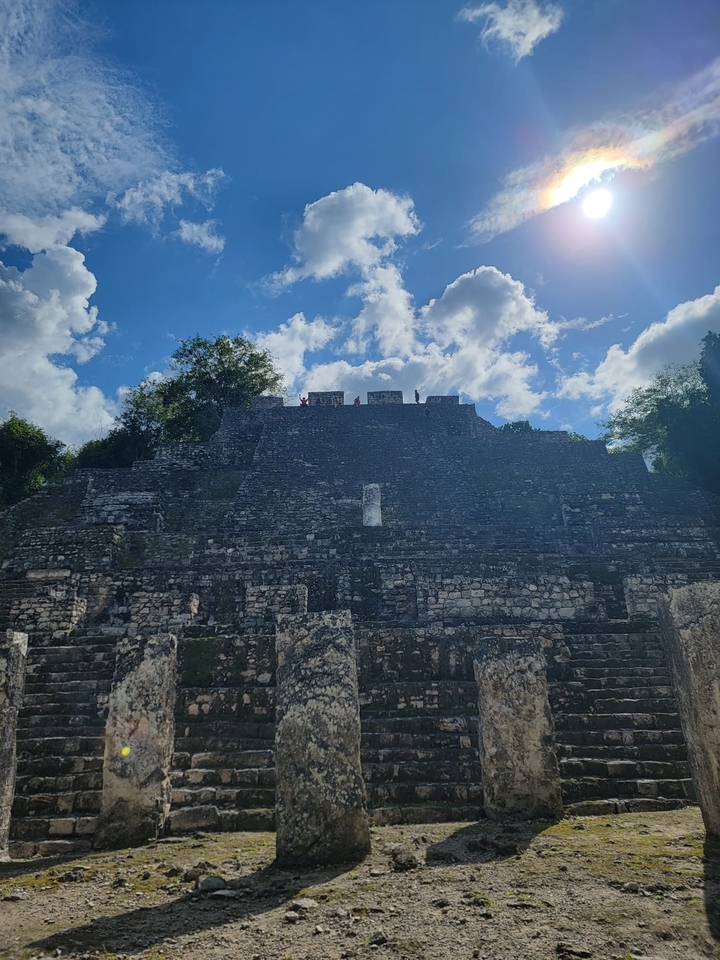 Stone pyramid under a clear blue sky.