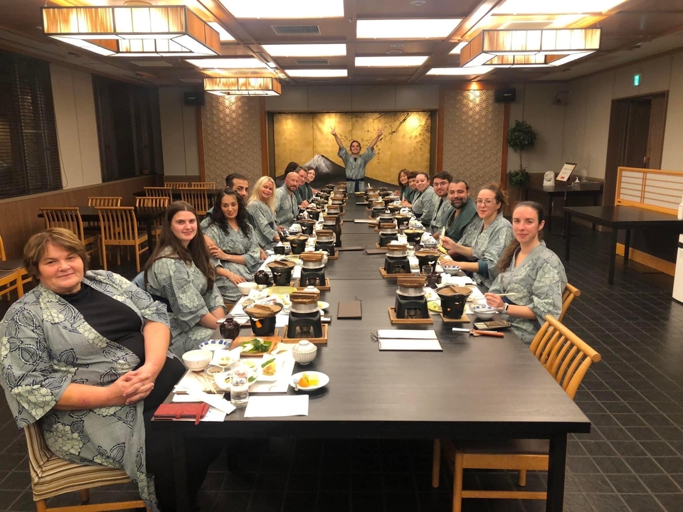 Group dining experience inside a traditional Japanese restaurant.