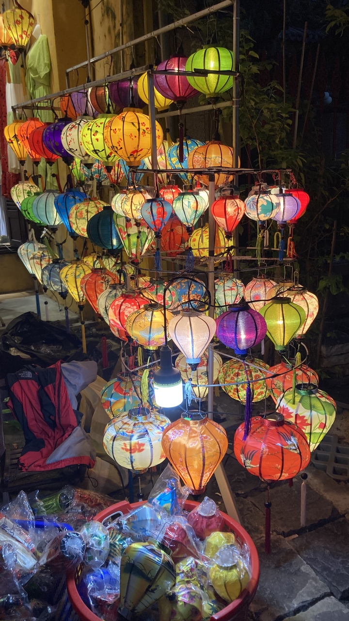 Colorful lanterns on display at night.
