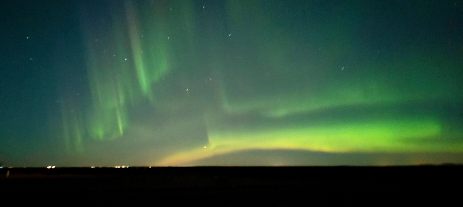 Aurora borealis illuminating the night sky.