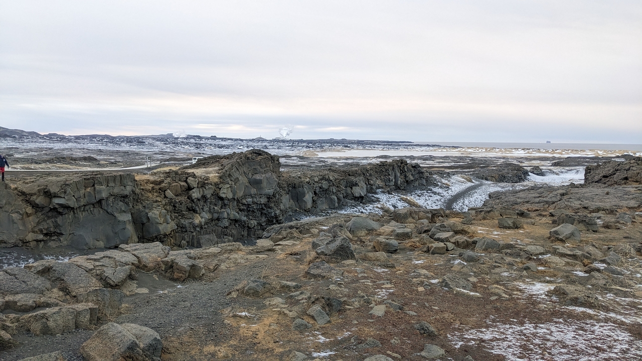 A rocky terrain with sparse vegetation.