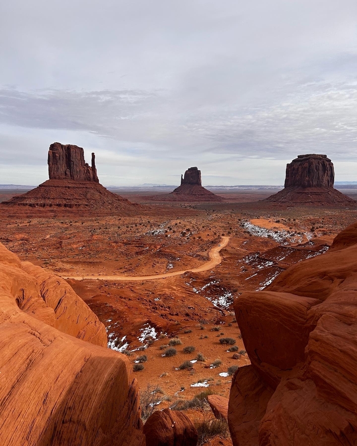Monument Valley with iconic buttes and a desert landscape.