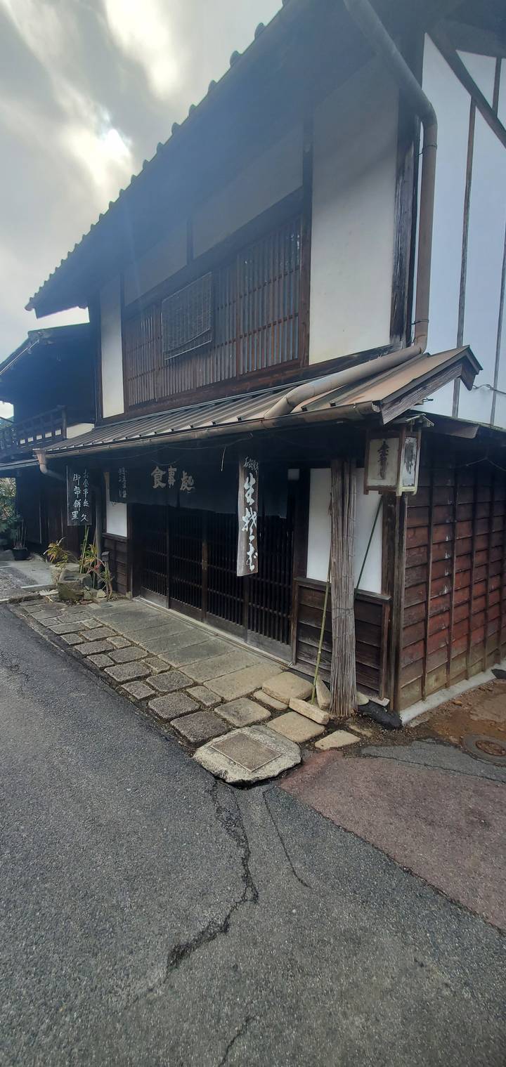 Traditional Japanese wooden building and street.