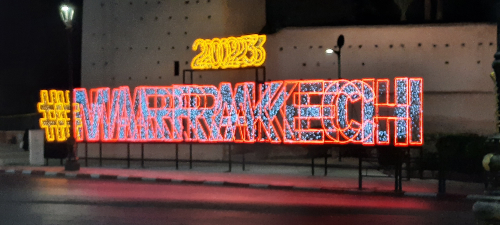 Blurred image of a light installation with '#MARRAKECH'.