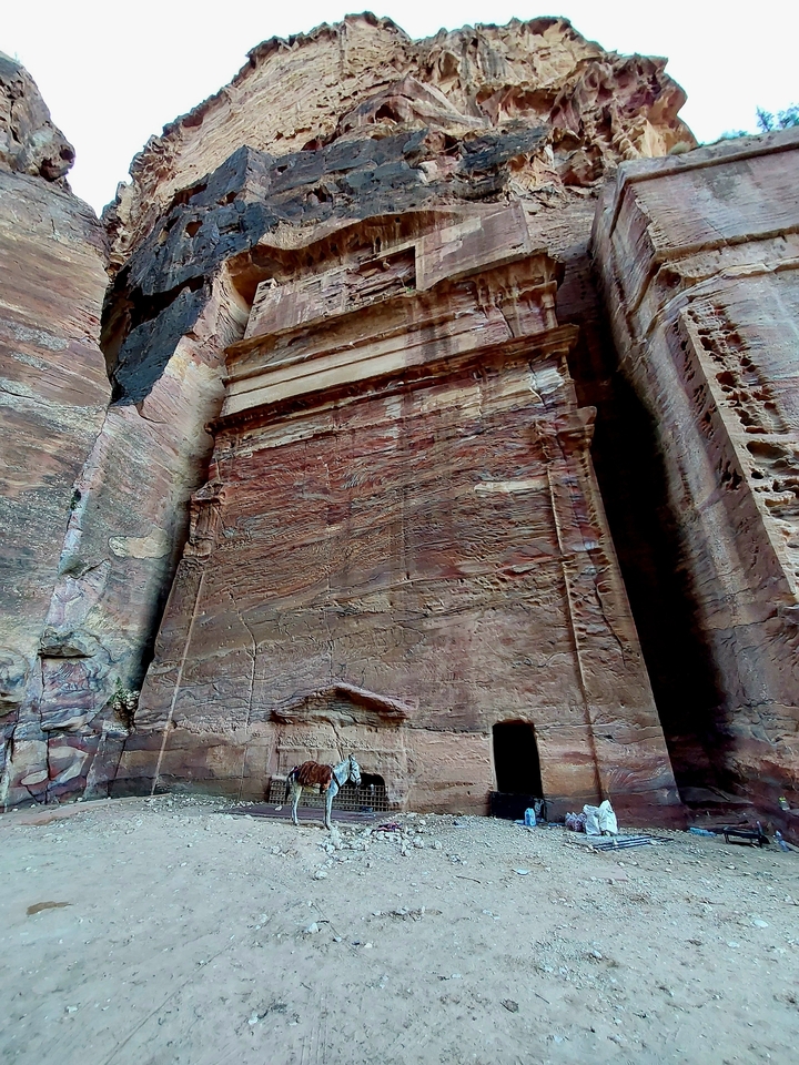 Carved rock facade with intricate designs.