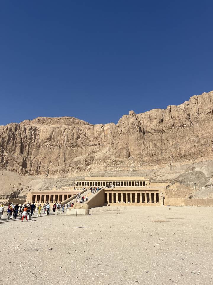 Ancient temple against a rocky hill.