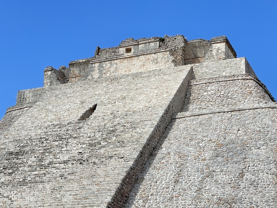 Mayan pyramid against a blue sky.