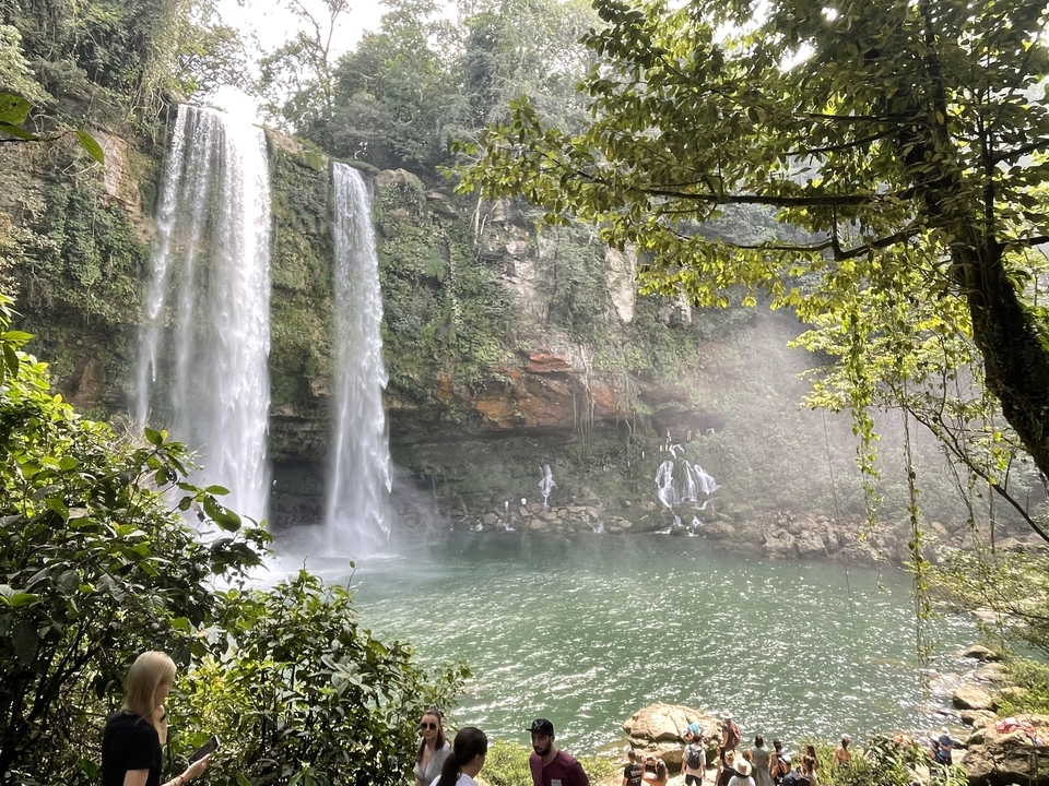 Beautiful waterfall with mist and greenery.