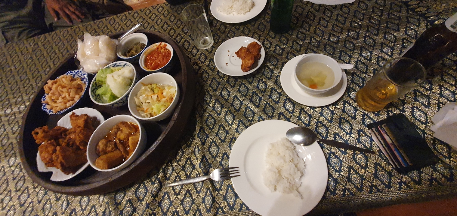 Traditional meal setup on a table with various dishes.