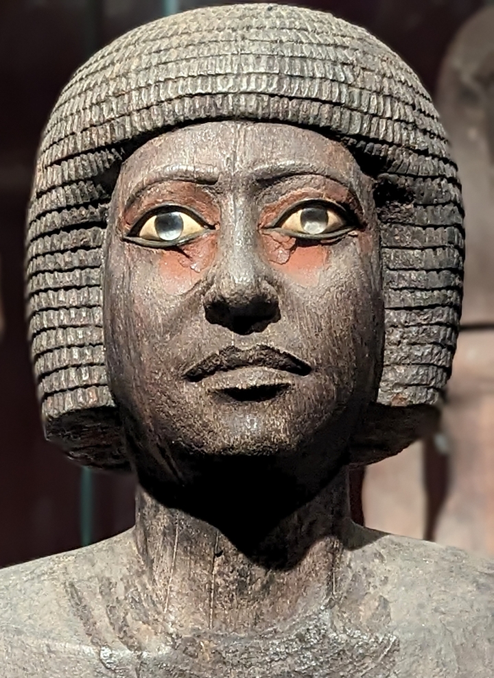Close-up of an ancient statue's face.
