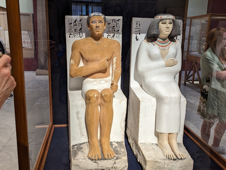 Ancient Egyptian statues in a museum display.