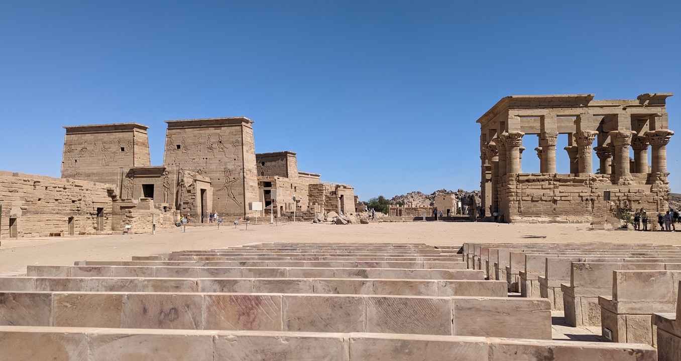 Columns and ancient ruins in a wide plaza.