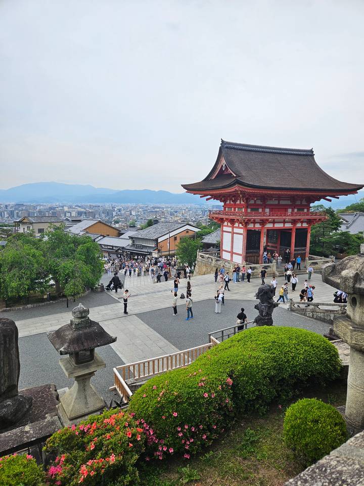 Large temple with tourists walking around.