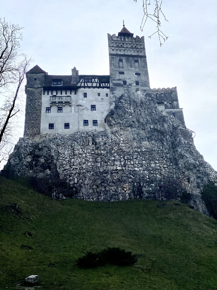 Castle built on a rocky hilltop.