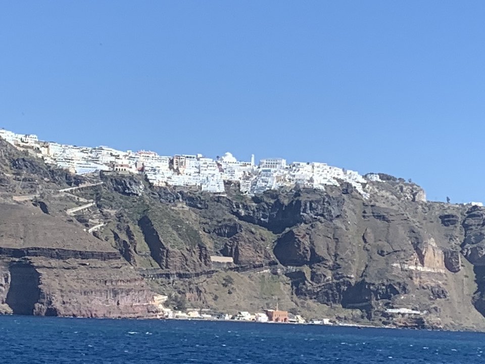 Town on a cliff with white buildings.