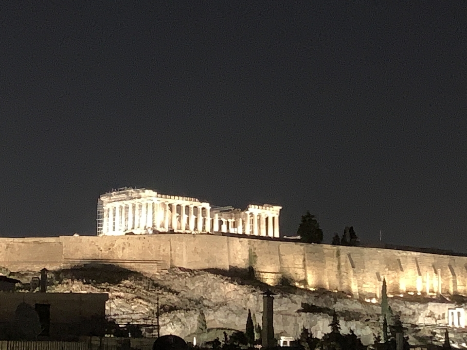 Acropolis illuminated at night.