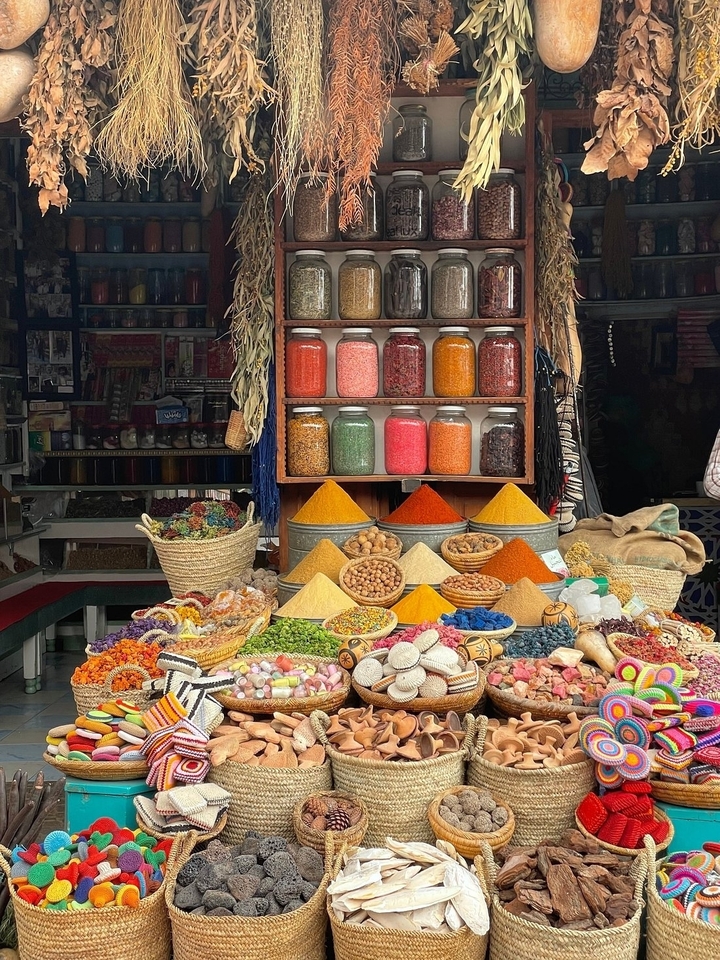 Spice market with colorful spices displayed in baskets.