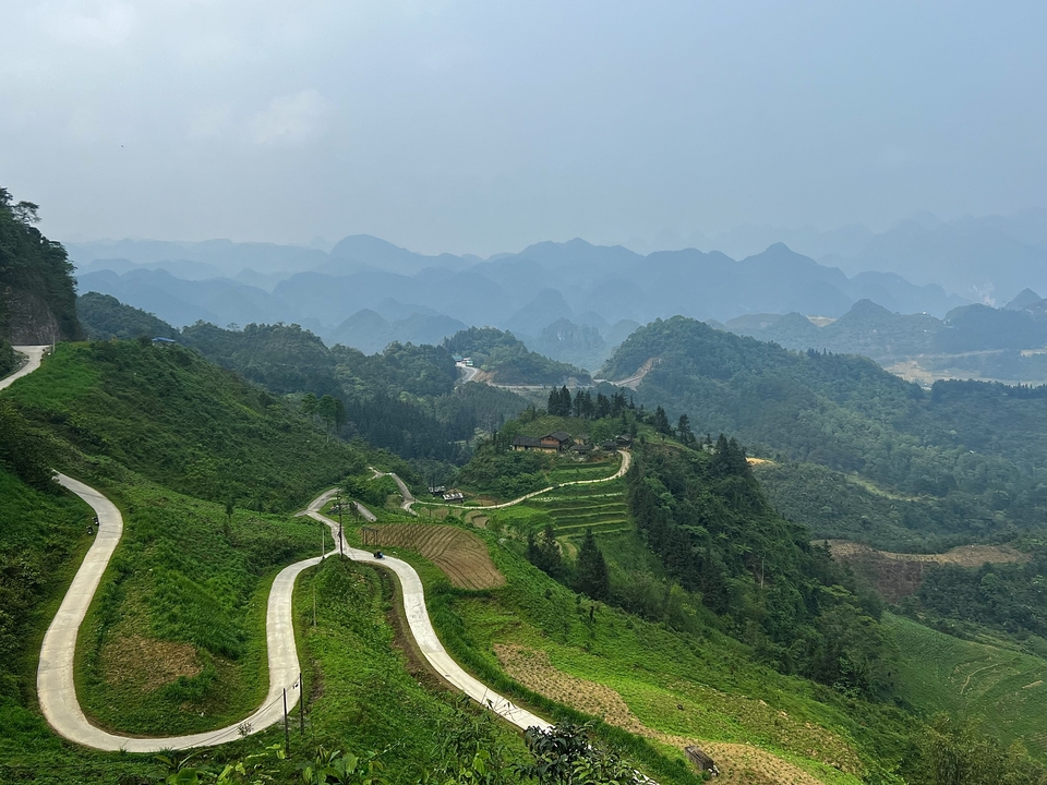 Winding roads through green hills and mountains.