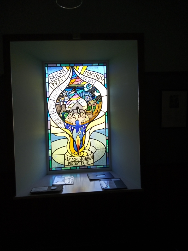 Stained glass window with religious imagery.