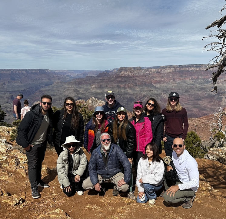 Group posing with Grand Canyon in the background.