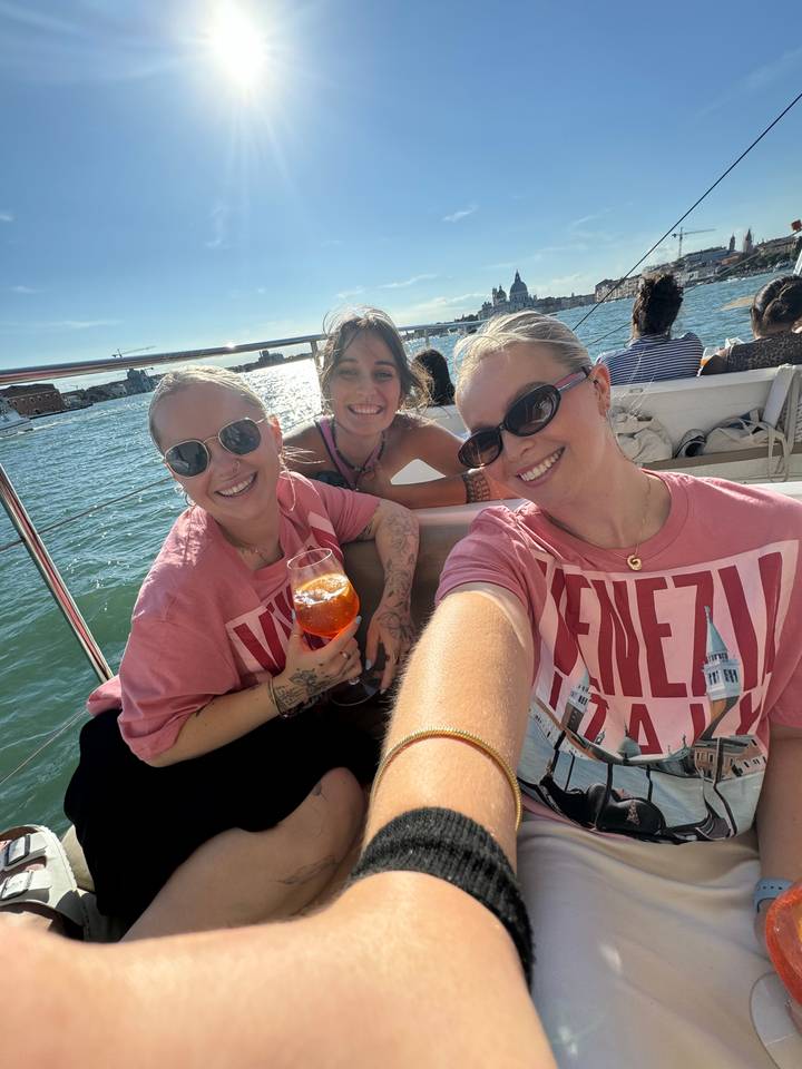 Two women taking a casual selfie on a boat.