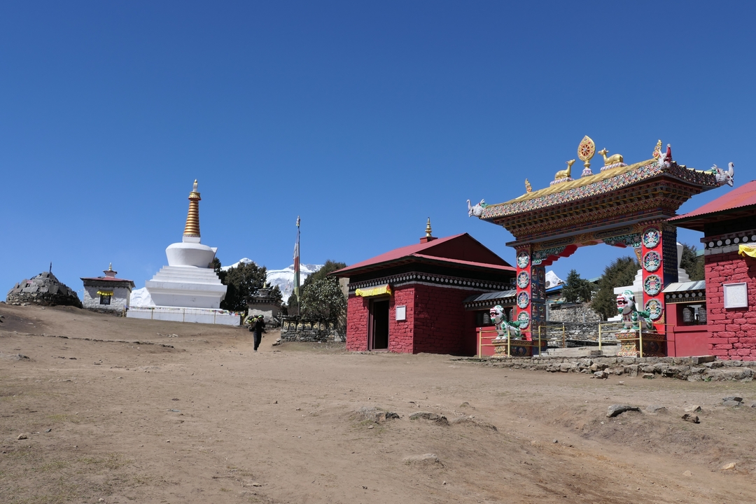 Stupa and traditional buildings in a village.