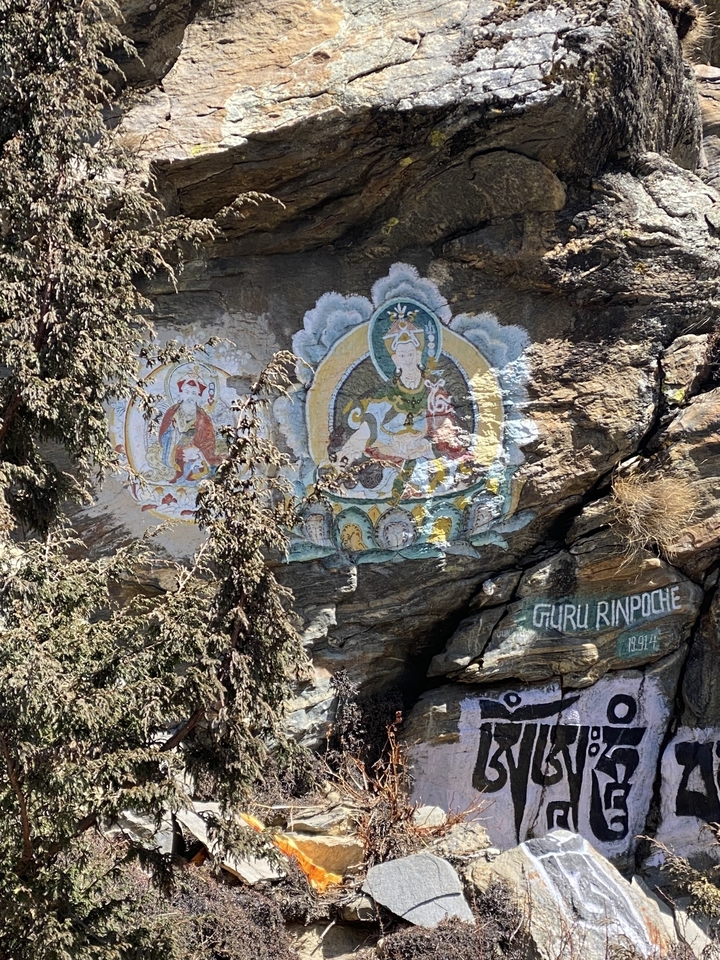 Buddhist paintings on a rock face.