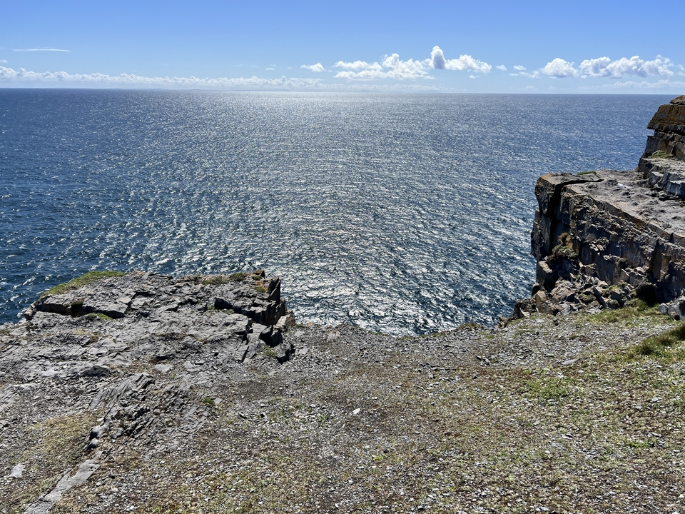 Coastal cliff with a view of the ocean.