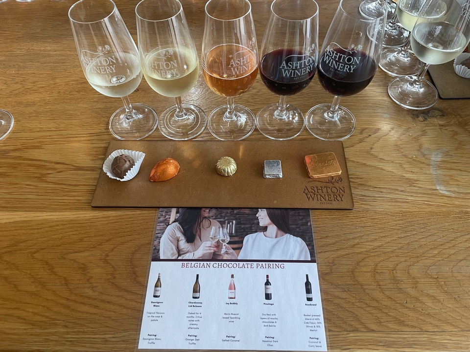 Selection of wines paired with chocolates at a wine tasting.
