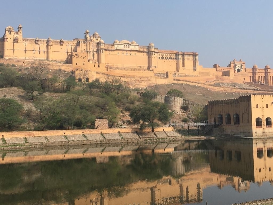 Historic fort with water reflection.