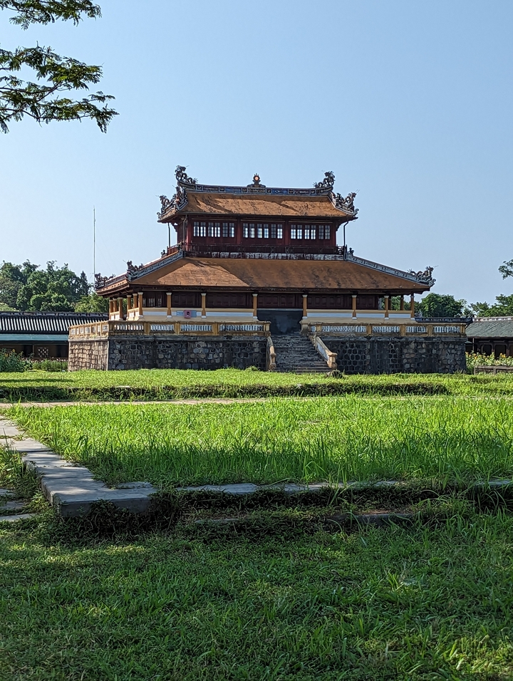 Traditional Vietnamese temple with greenery.