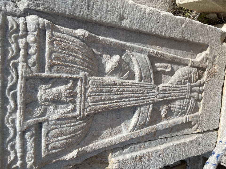 Close-up of an ancient stone carving with intricate details.