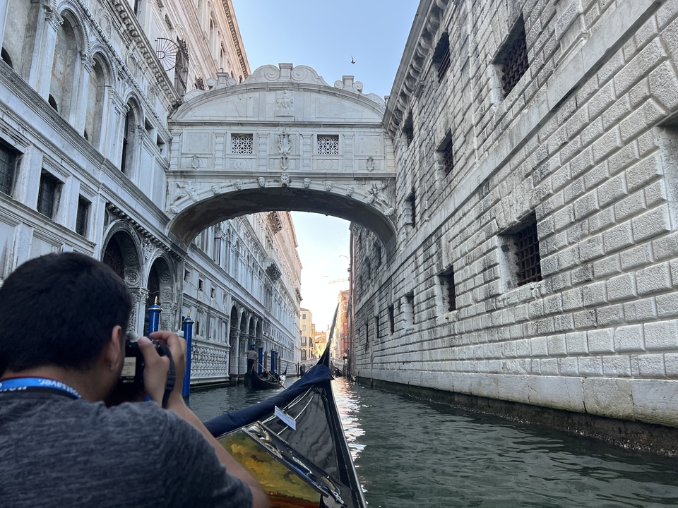 View from a gondola passing the Bridge of Sighs, Venice.